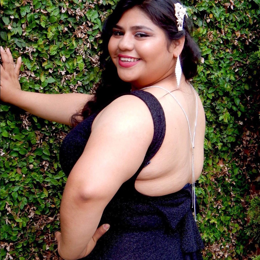 Black sparkling open back prom dress.